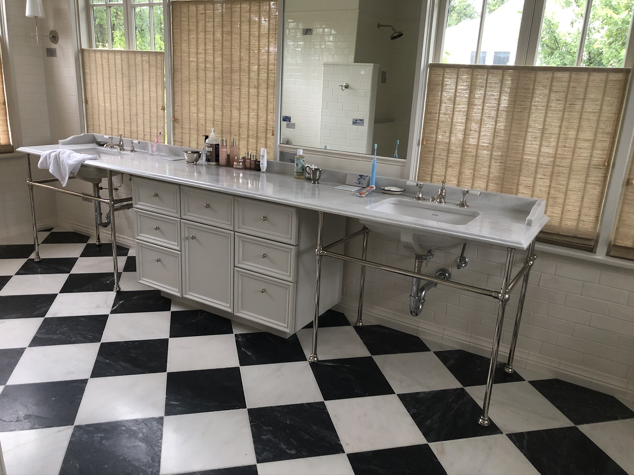 Marble Jack-and-Jill Bathroom Vanity with All White Cabinets and Silver Hardware