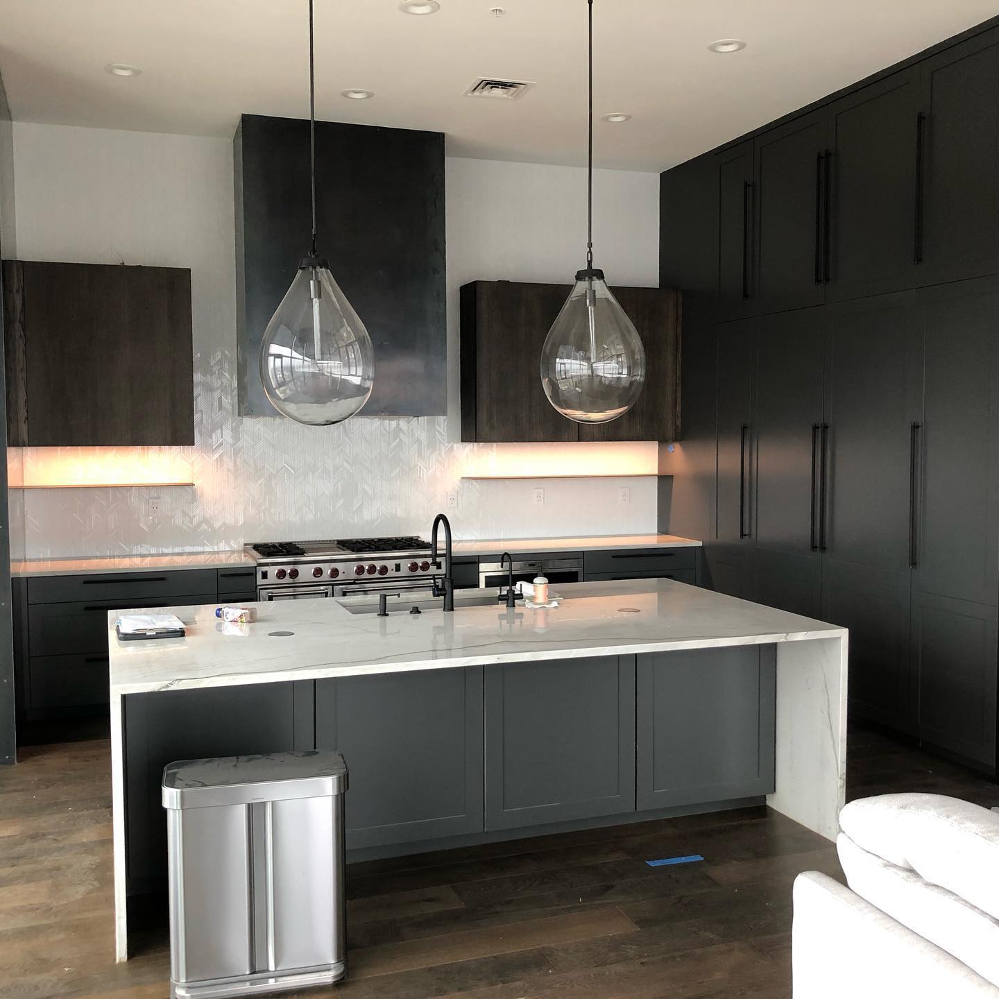 Sleek All Black Cabinets with Marble Island